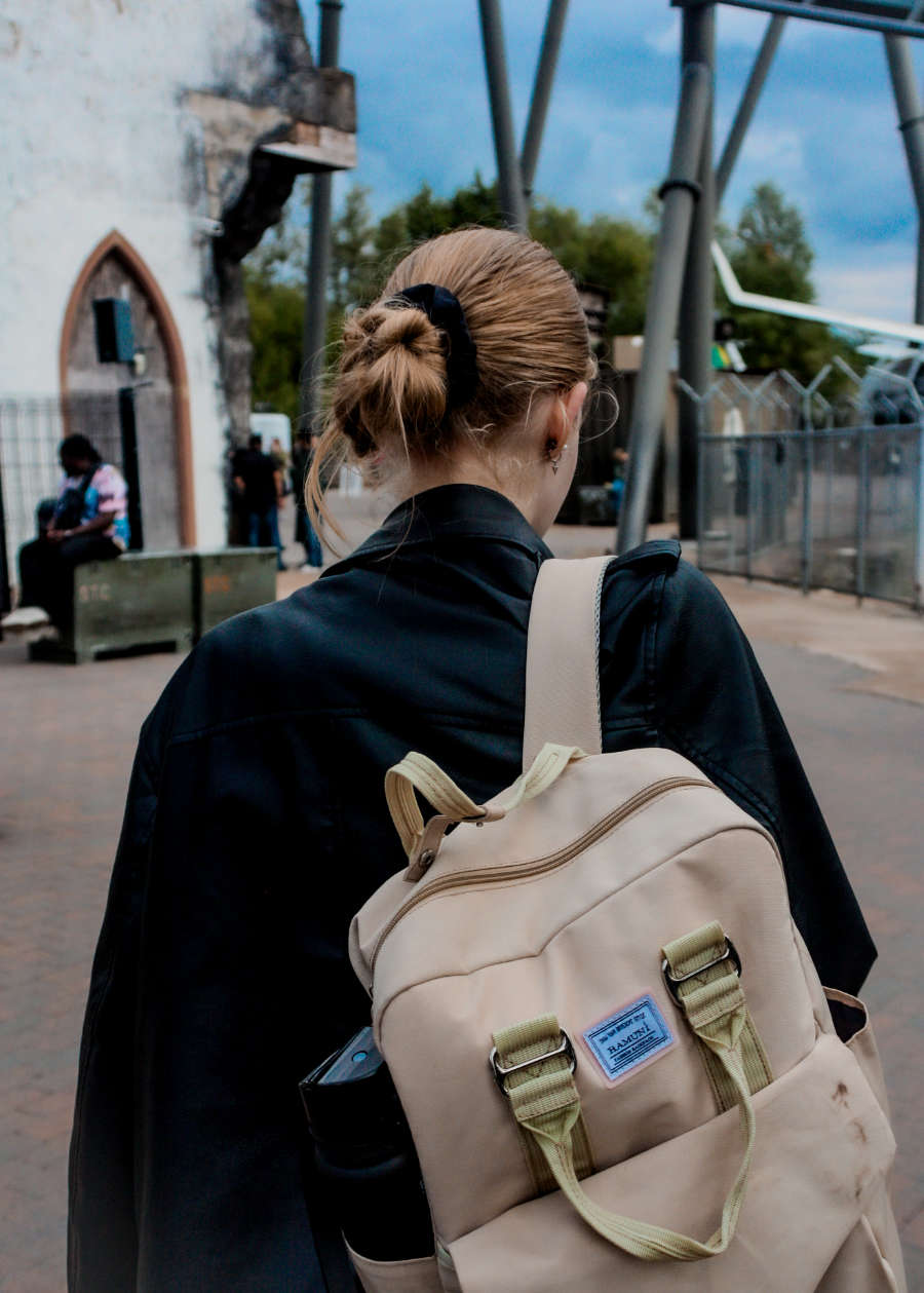 Urban portrait of woman with backpack – street-style photography in Petersfield